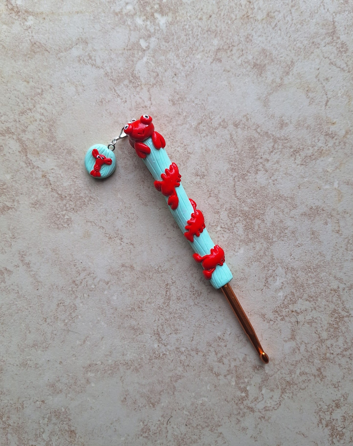 Polymer clay lobster on mint nautical crochet hook with stitch marker