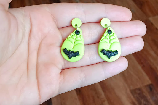 Kawaii green spiderweb bat earrings / polymer clay dangle stud holiday earrings / flying bat halloween holiday jewelry / spider web earrings
