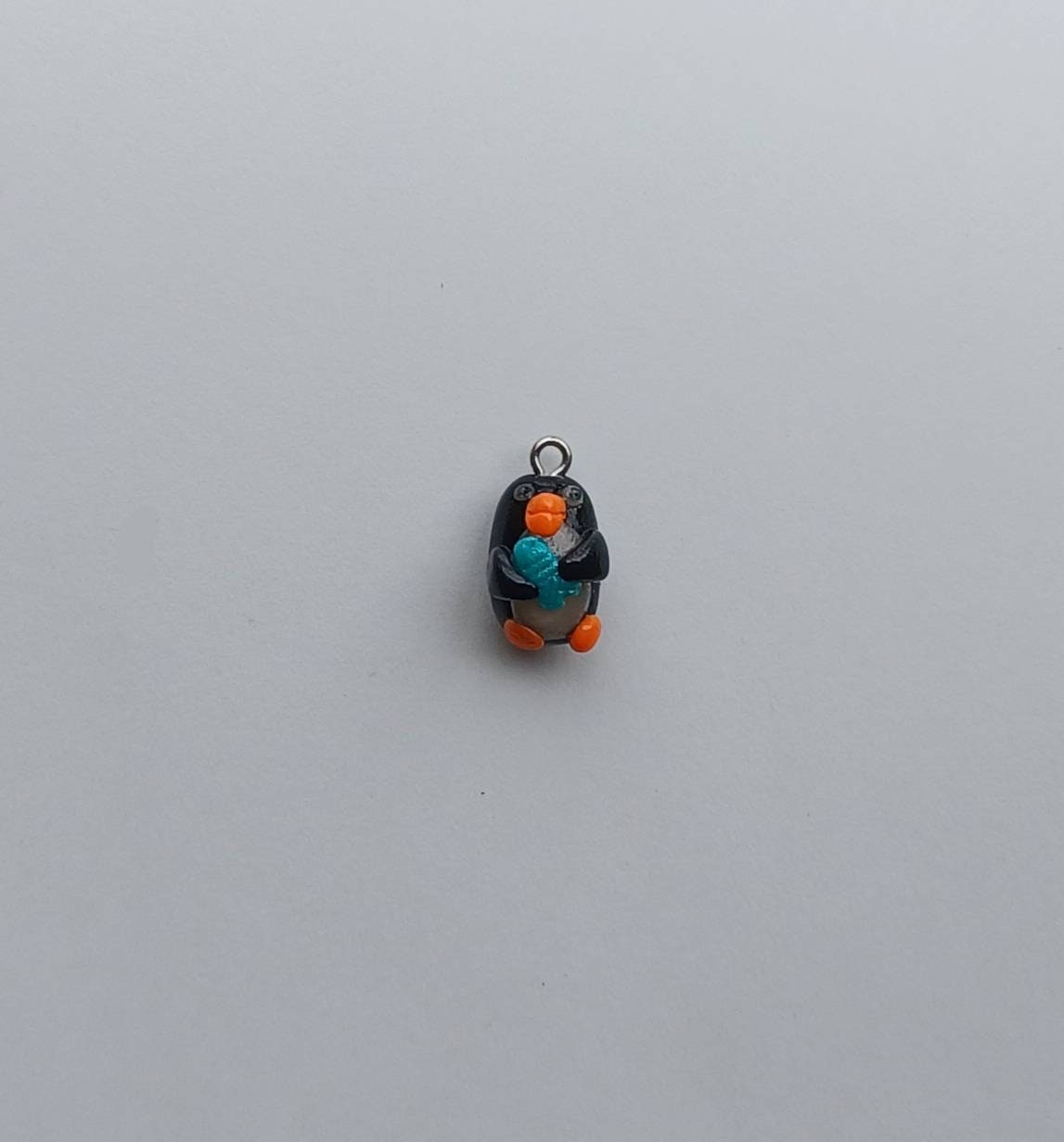 Kawaii penguin charms / polymer clay penguin holding fish charms / kawaii animal charms / kawaii penguin jewelry