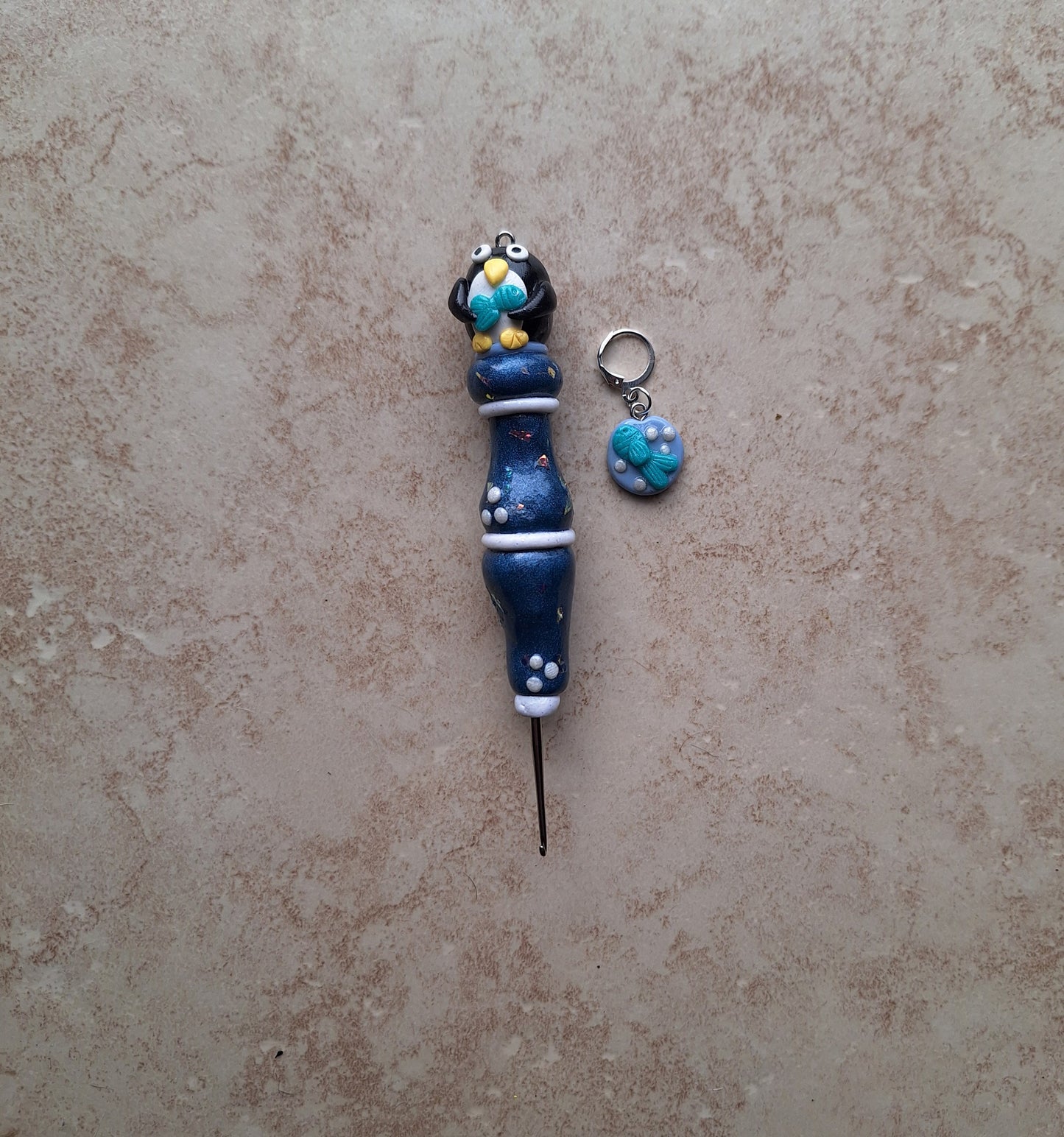 Polymer clay navy pearl penguin crochet hook with stitch marker