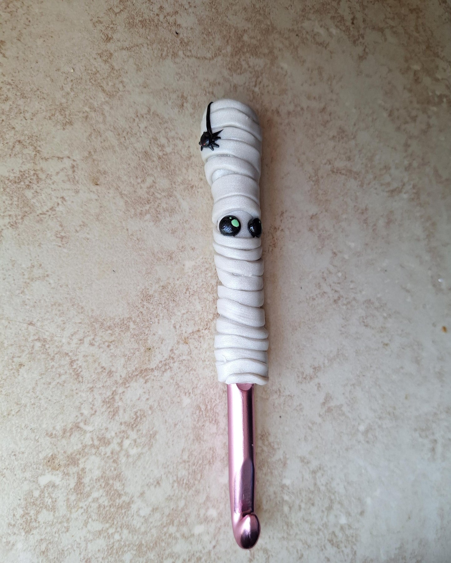 Polymer clay Halloween mummy with spider crochet hook