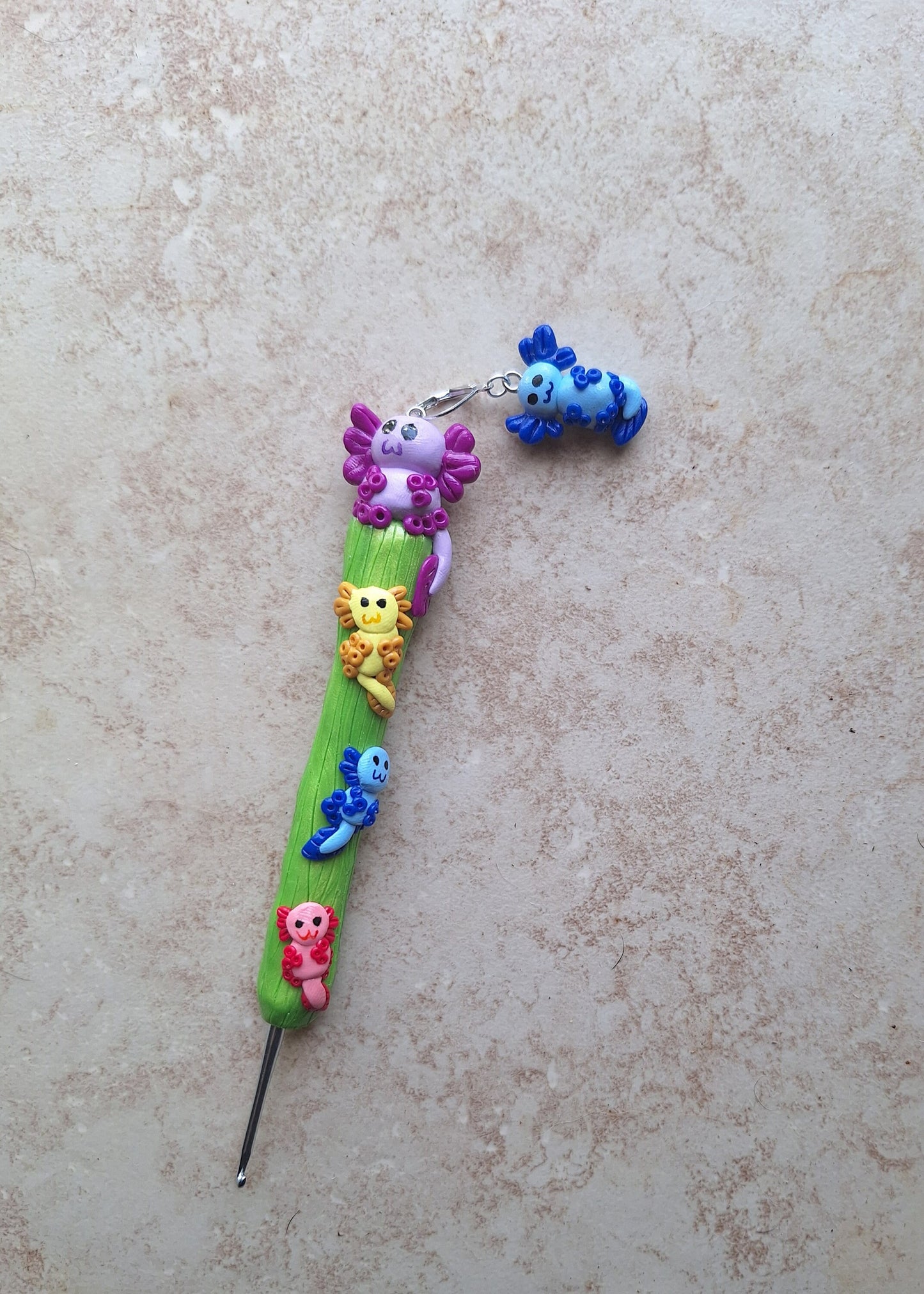 Polymer clay colorful axolotl crochet hook with stitch marker