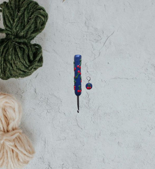 Polymer clay fruit cherries on navy crochet hook with stitch marker