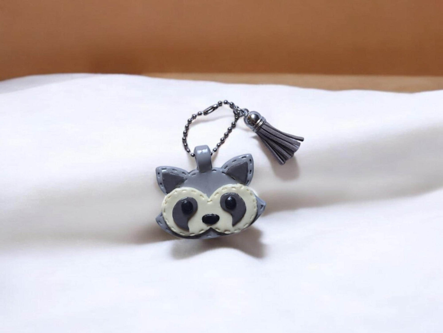 Polymer clay raccoon faux leather look stitch style keychain / cute clay raccoon bag accessories key chain