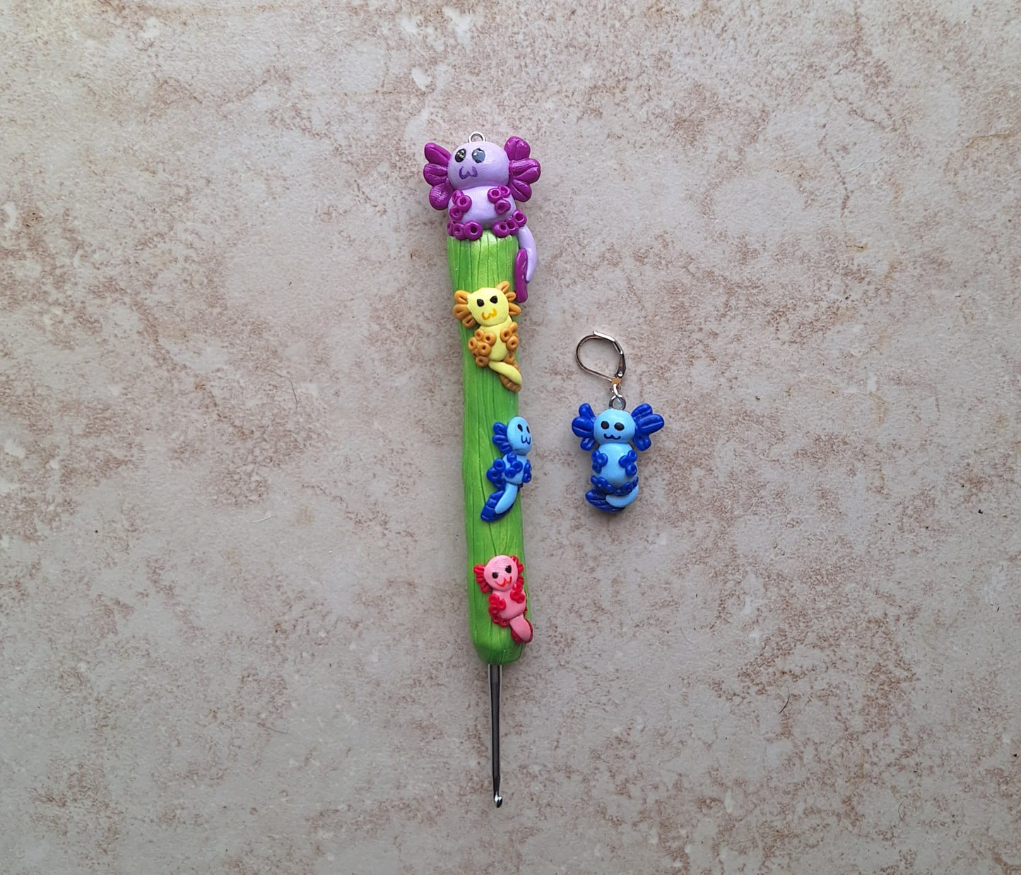 Polymer clay colorful axolotl crochet hook with stitch marker