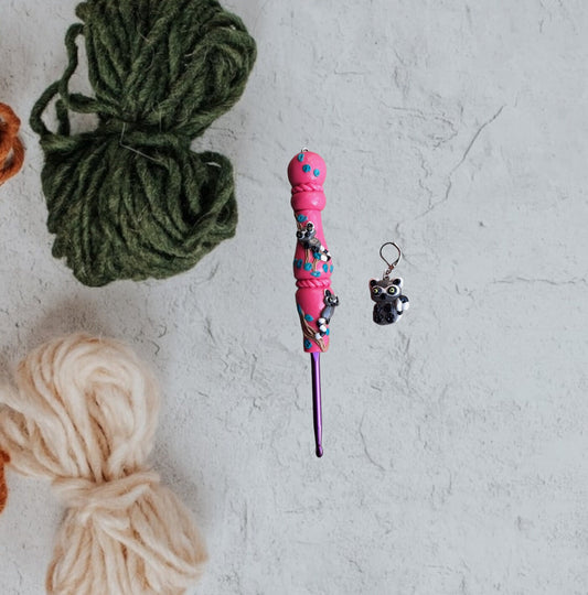 Polymer clay pink glitter lemur on branch crochet hook