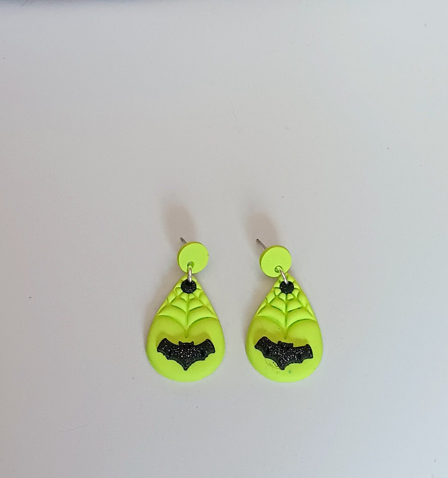 Kawaii green spiderweb bat earrings / polymer clay dangle stud holiday earrings / flying bat halloween holiday jewelry / spider web earrings