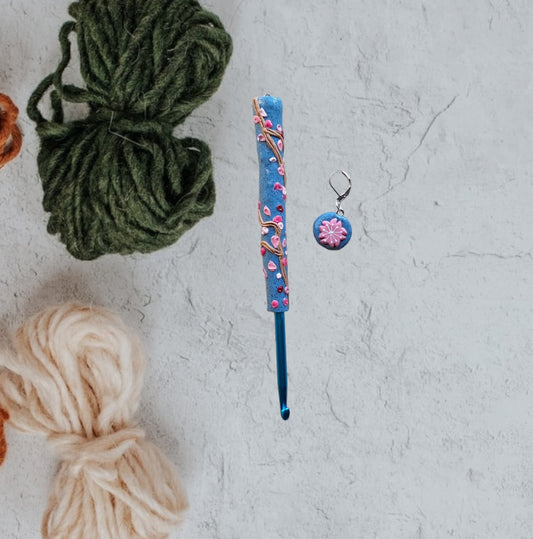 Polymer clay spring floral Sakura on blue crochet hook