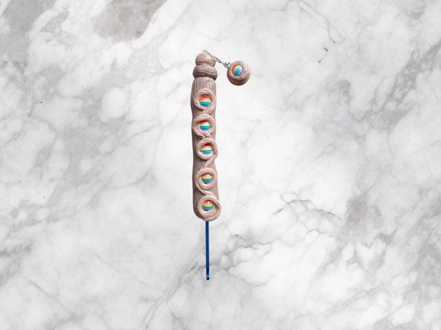 Handmade polymer clay faux wood grain rainbow crochet hook with stitch marker